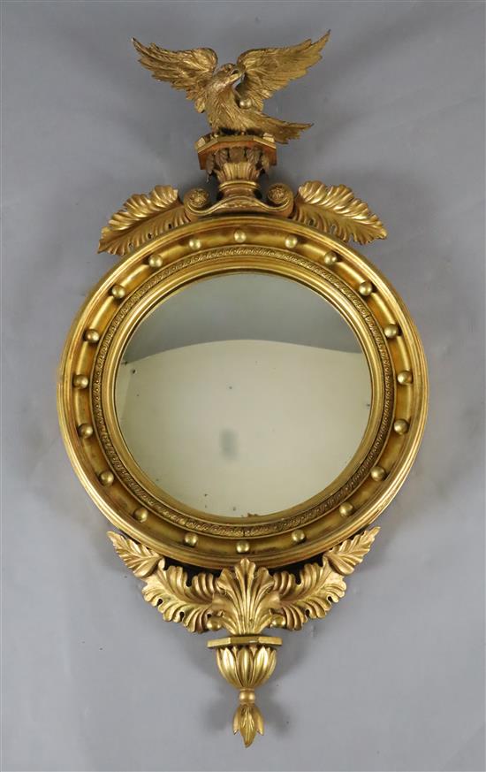 A William IV giltwood and gesso convex wall mirror, W.1ft 10in. H.3ft 5in.